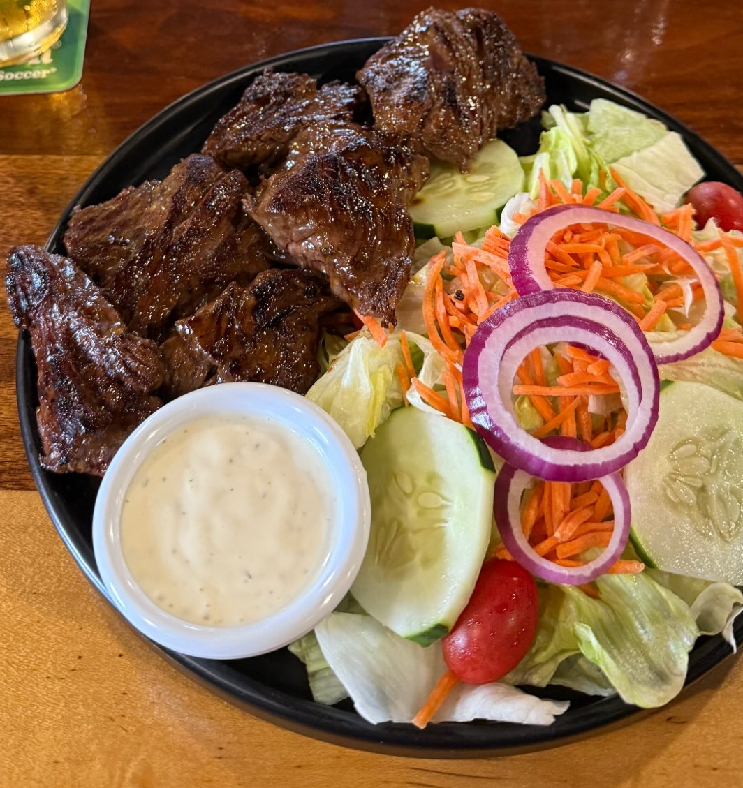 Steak tips with salad at Woody's Parkway Pub