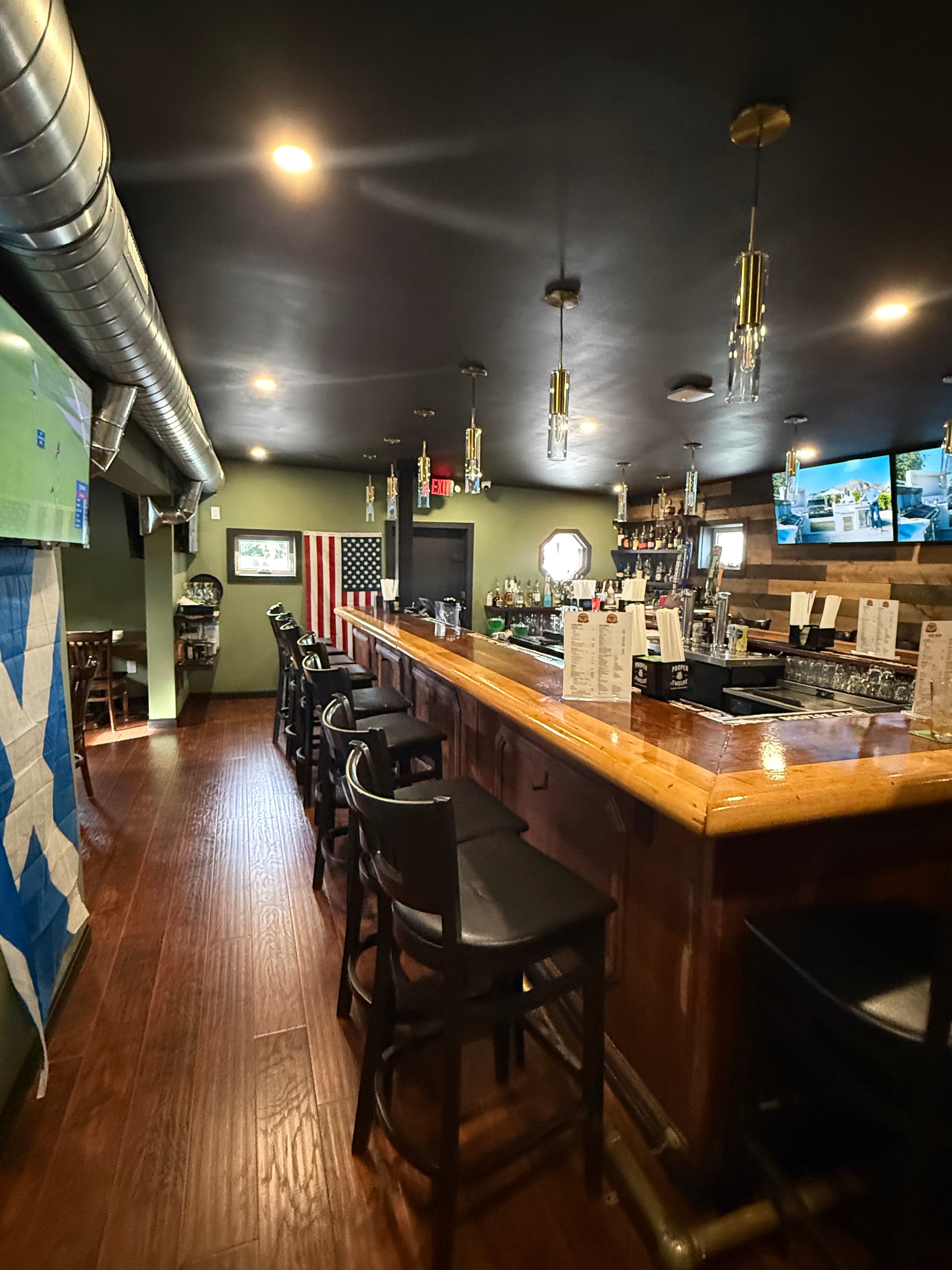 Televisions showing sports inside Woody's Parkway Pub